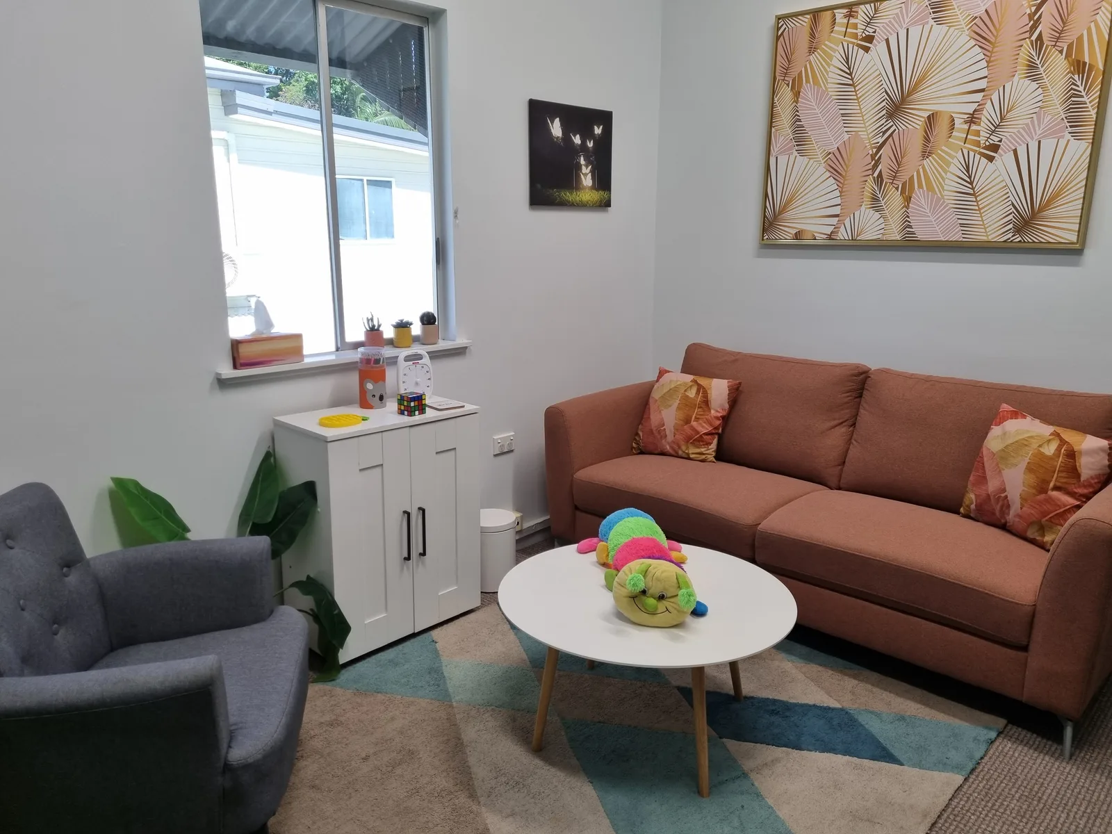 Therapy room at Caterpillar Clinic in Cairns with comfortable seating for children and families